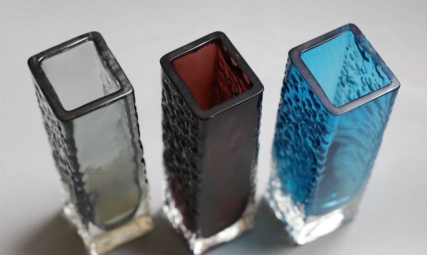 A trio of Whitefriars 'Nailhead' vases, model 9683, designed by Geoffrey Baxter, each 17cm high